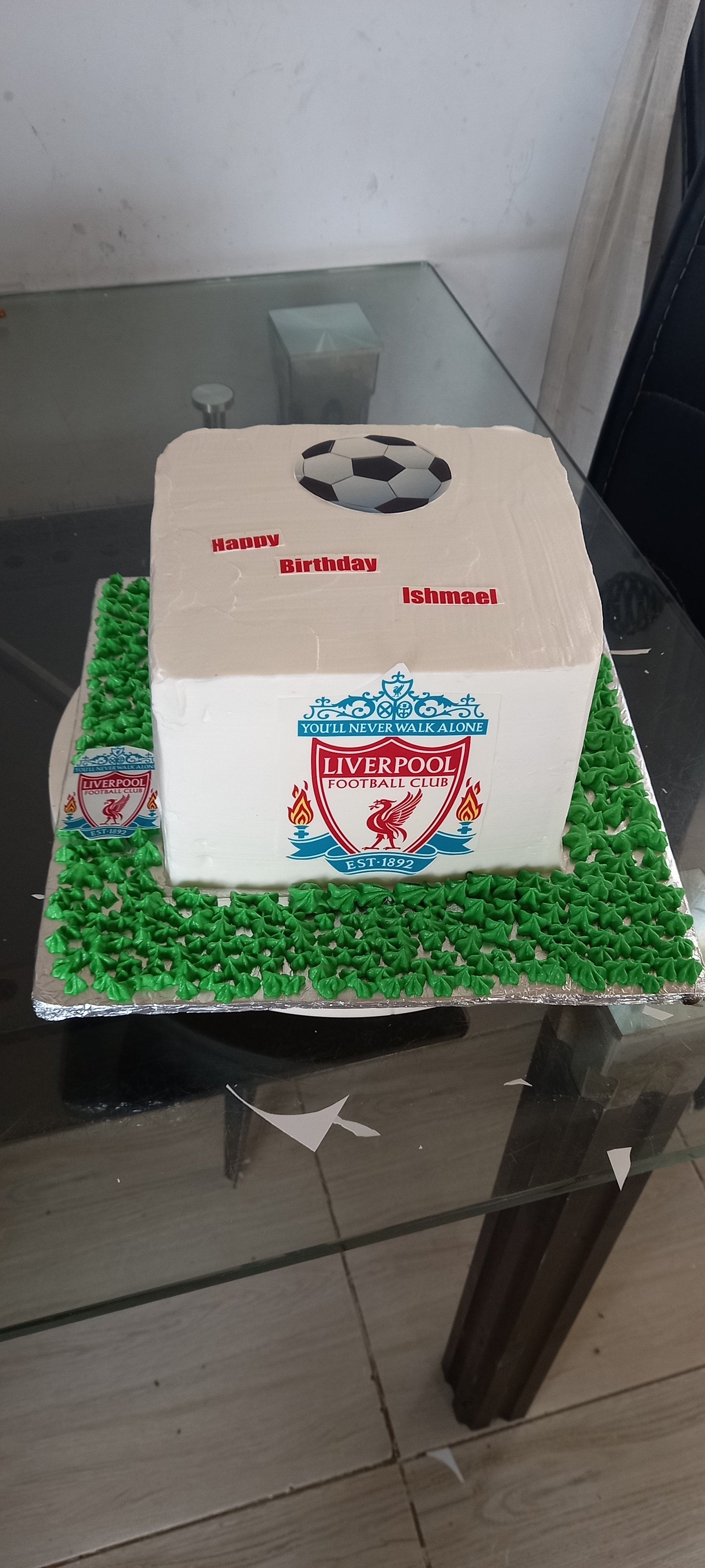 Liverpool Football Club themed birthday cake with green grass and soccer ball