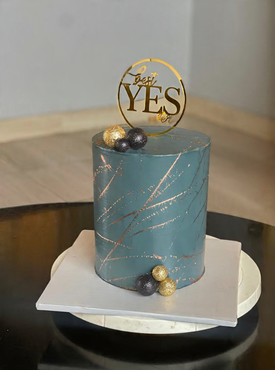 Teal and rose-gold engagement cake with YES topper